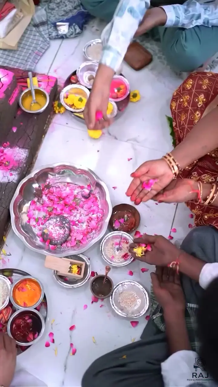 Kumbh and petals — vastu pooja film, May 2026